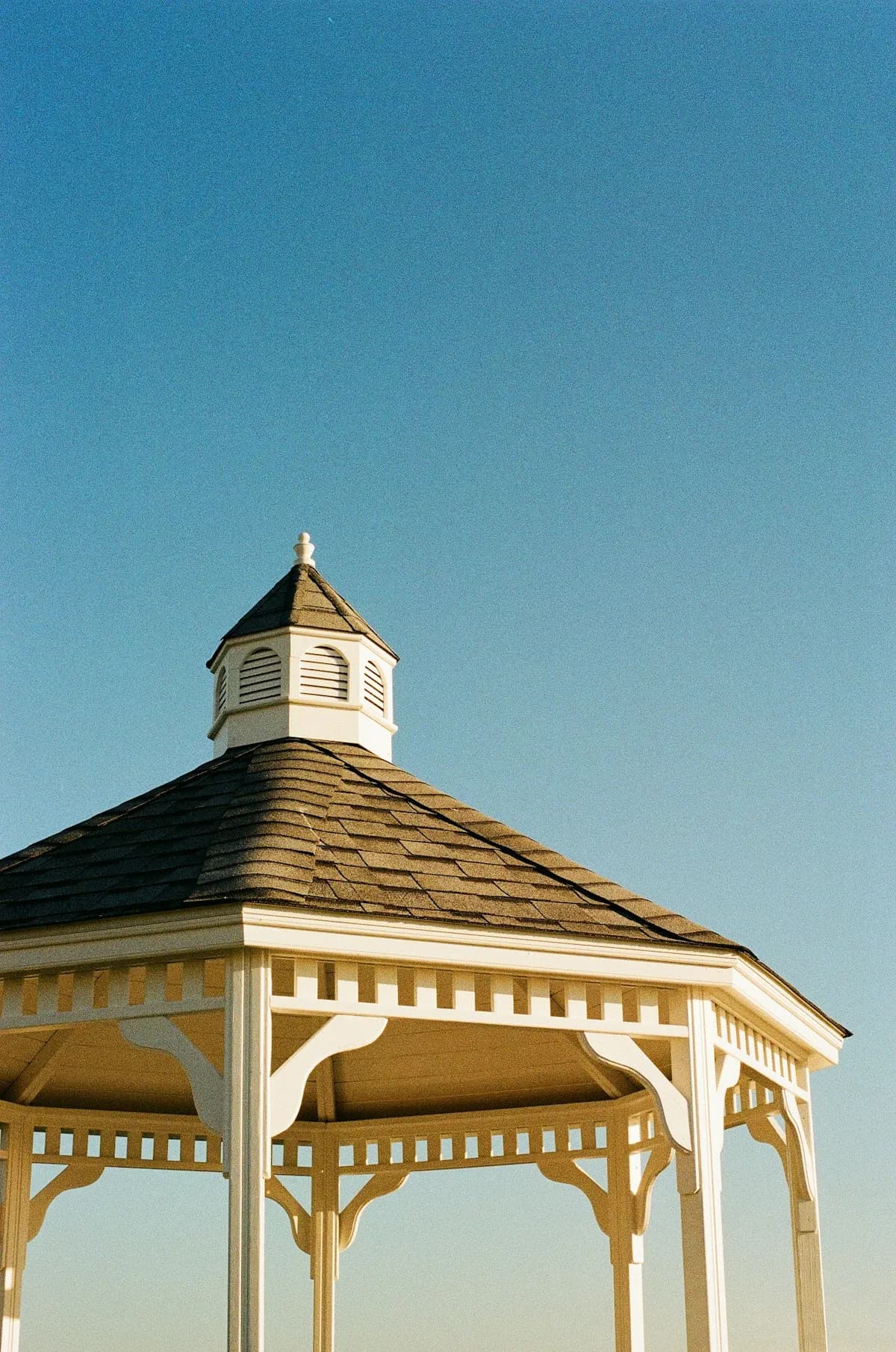 Close view of a gazebo roof and decorative brackets
